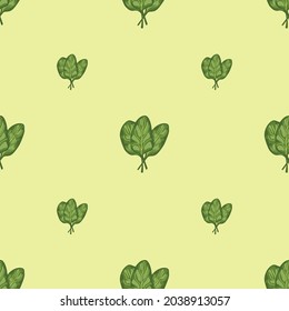 Seamless pattern bunch spinach salad on pastel yellow background. Modern ornament with lettuce. Geometric plant template for fabric. Design vector illustration.