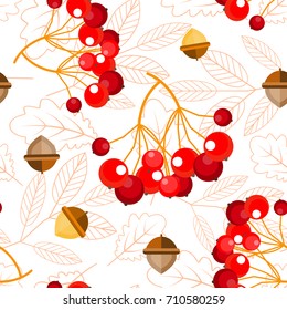 Seamless pattern: bunches of Rowan berries, acorns on a light background of 
oak leaves and leaves of mountain ash. Autumn