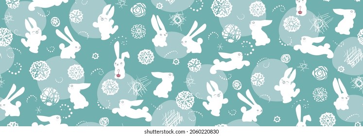 patrón impecable con conejillos. Abundantes, copos de nieve sobre un fondo azul pálido y turquesa. Para tela, envolturas, papel pintado, etc.