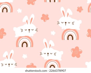 Seamless pattern with bunny rabbit cartoons, rainbows and cute flower on pink peach background vector illustration. Cute childish print.