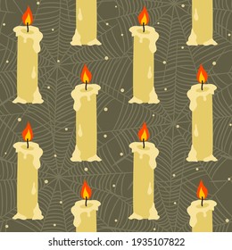 Seamless pattern with burning candles and cobwebs. Hand drawn wax candles on a dark background. Vector illustration