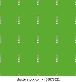 Seamless pattern of burning candles. Vector EPS 10.