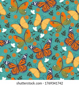 Seamless pattern with butterflies and flowers. Vector graphics.