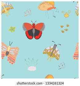Seamless pattern with butterflies on blue background. Endless texture for design, clothing, postcards, posters. Vector