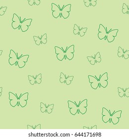 Seamless pattern of butterflies on a green background. Vector picture of moths