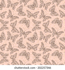 Seamless pattern with butterflies on a pink background