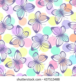 Seamless pattern with butterflies on a polka dot background.