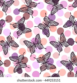 Seamless pattern with butterflies on a polka dot background