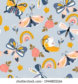 Seamless pattern of butterflies and rainbows in boho style. Vector graphics.