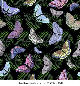Seamless pattern with butterflies and tropical exotic leaves.