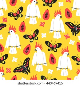 Seamless pattern with butterfly, papaya, flowers and cockatoo on yellow background
