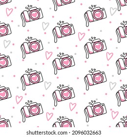 Seamless pattern of cameras and hearts on a white background. Use on Valentines Day on textiles, wrapping paper, backgrounds, souvenirs. Vector
