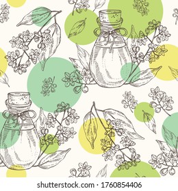 Seamless pattern with camphor tree flowers and bottle of camphor essential oil. Cosmetic, perfumery and medical plant. Vector hand drawn illustration.
