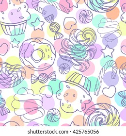 Seamless pattern with candy, donuts and lollipops on a polka dot background.