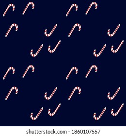 Seamless pattern with candy sticks on dark blue background