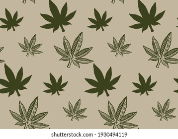 Seamless pattern with a cannabis leaf on white background.