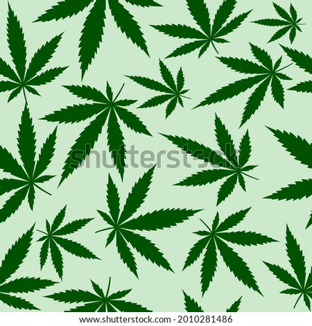 Seamless pattern with cannabis leaves green style isolated on light green wallpaper Suitable for backgrounds, fabrics, wrapping paper, packaging. Vector illustration
