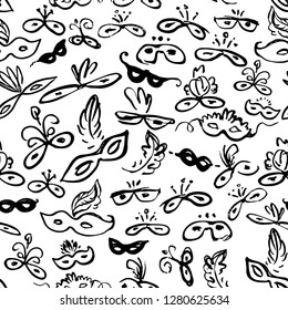 Seamless pattern of carnival masks. Beautiful black masks of lace. Mask for a masquerade. Vector background party mask.