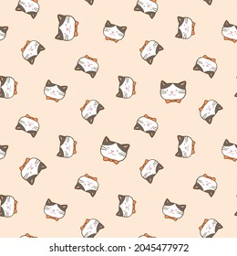 Seamless Pattern with Cartoon Cat Face Design on Light Orange Background