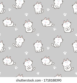 Patrón sin problemas con gatos de dibujos animados y patas en fondo gris 