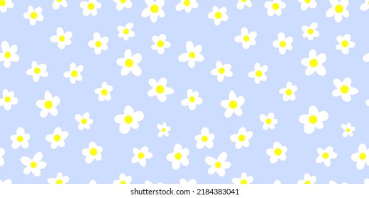 Seamless pattern with cartoon chamomiles on a blue background. Vector doodle illustration.