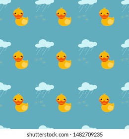 Seamless pattern with cartoon ducks on a blue background. Cloud pours rain on daisies.