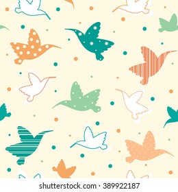 Seamless pattern with cartoon hummingbirds. Vector wallpaper with colored birds on a yellow background. 