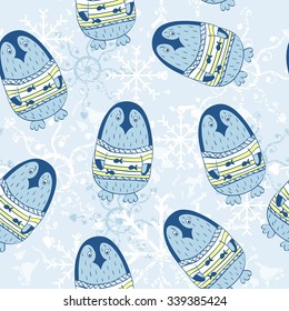 Seamless pattern with cartoon penguins and snowflakes