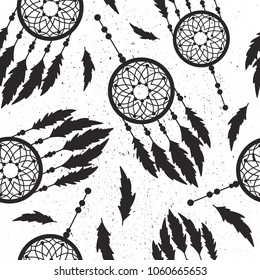 Seamless pattern with catchers for dreams and feathers, hand drawn background. Black and white illustration, indian dreamcatchers. Decorative wallpaper, good for printing. Overlapping backdrop vector