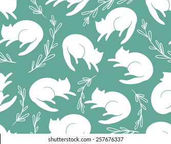 Seamless pattern with cats and a grass on turquoise background