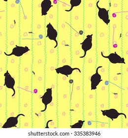 Seamless pattern of cats, mice and balls on a yellow wallpaper background with flowers.
