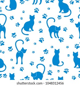Seamless pattern with cats and pawprints. Template for design, fabric, print.