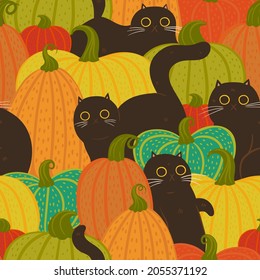 Seamless pattern with cats and pumpkins. Vector graphics.