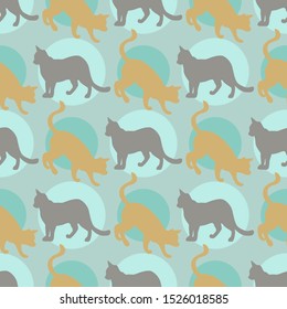 Seamless pattern with cats silhouettes on a blue background