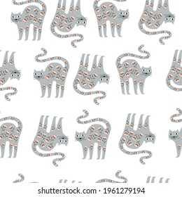 Seamless pattern of cats that are covered with flowers. Vector illustration 