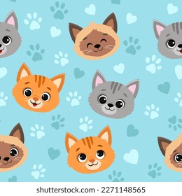 Seamless pattern with cats.Cute cartoon kittens on blue background.Vector illustration