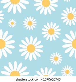 Seamless pattern with chamomile flowers on blue background.