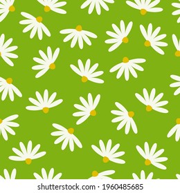 Seamless pattern with chamomile flowers on a green background.