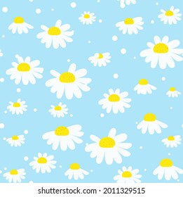 Seamless pattern with chamomile flowers on blue background. EPS 10