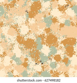 Seamless pattern. Chaotic blots and splashes of different colors. Fashionable camouflage. Yellow, brown, beige, pale green.