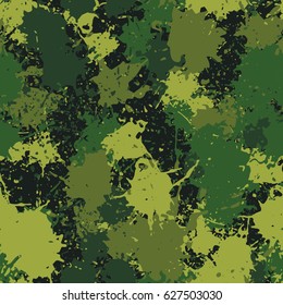 Seamless pattern. Chaotic blots and splashes of different colors. Fashionable camouflage. Green, khaki, yellow-green.