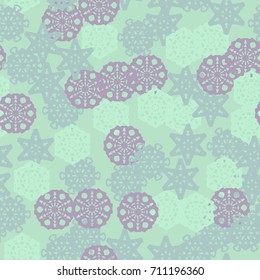 Seamless pattern. Chaotic pattern of colored stylized snowflakes. The drawing can be used as a camouflage.