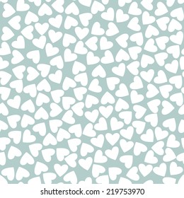 Seamless pattern with chaotic hearts. Valentine's Day background. Fine pastel texture