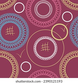 Seamless pattern with chaotically arranged multi-colored ornamented rings and other objects on a burgundy background. Vector illustration