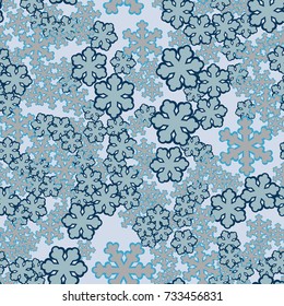 Seamless pattern. Chaotically scattered snowflakes.