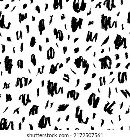 Seamless pattern with charcoal blots and strokes. Black painted different dots. Chaotic ink brush scribbles decorative texture. Messy black pencil doodles. Speckles of different size texture. 