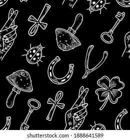 Seamless pattern with Charms of Good Luck. Hand drawn doodle Lucky symbols set. Luck symbols of wealth elements Ladybug Clover Horseshoe Wishbone, key