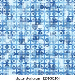 Seamless pattern. Checkered camouflage with squares and rhombuses located on top. Ice shades.