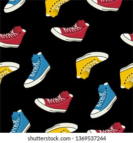 Seamless pattern cheerful multi-colored sneakers on a black background