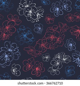 Seamless pattern of cherry blossoms, multicolored on dark blue